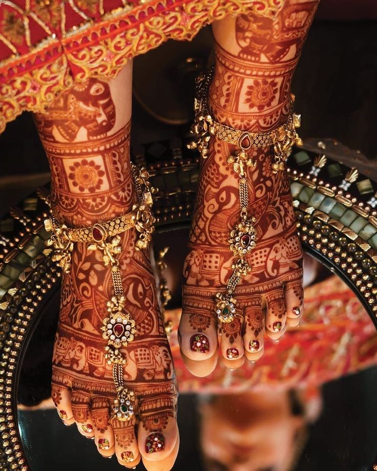 Leg mehndi designs with jewels and stones added